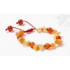 Karneol kristály és mala szemek, aranyszínű kis oszók, állítható karkötő, csuklómala