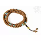 Rudraksha mala, korall és lápisz berakásos, türkiz osztóval, Buddha fejjel - a legmagasabb tudás és szellemi kitartás segítője